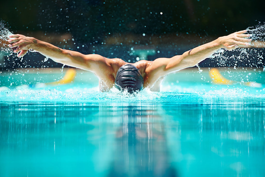 Why are shoulder injuries common in swimmers?