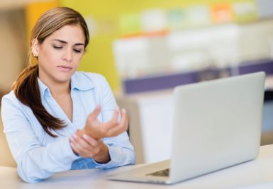 Carpal tunnel syndrome symptoms include numbness or tingling that can happen when typing.