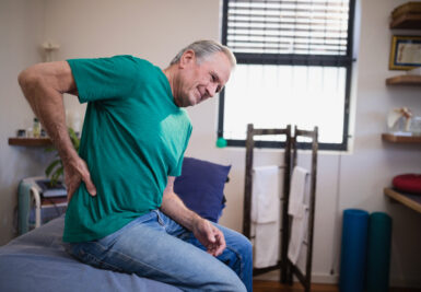 elderly man suffering from snapping hip pain